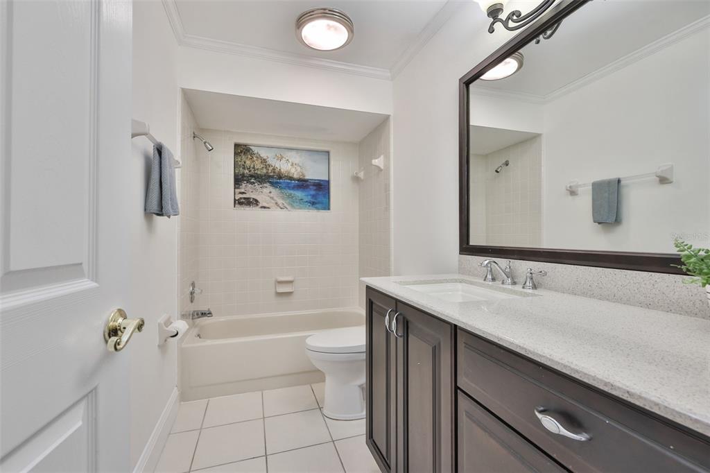 705 Baltusrol Way Sun City Center, FL 33573 - Photo 34 of 59 a bathroom with a tub sink and toilet