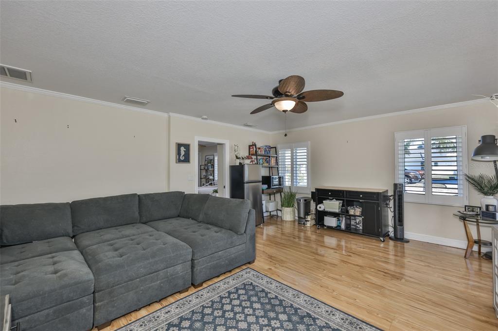 705 Baltusrol Way Sun City Center, FL 33573 - Photo 37 of 59 a living room with furniture and wooden floor