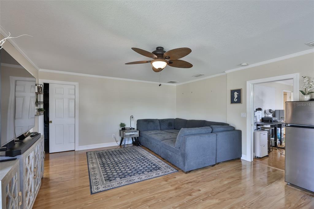 705 Baltusrol Way Sun City Center, FL 33573 - Photo 38 of 59 a living room with furniture and a rug