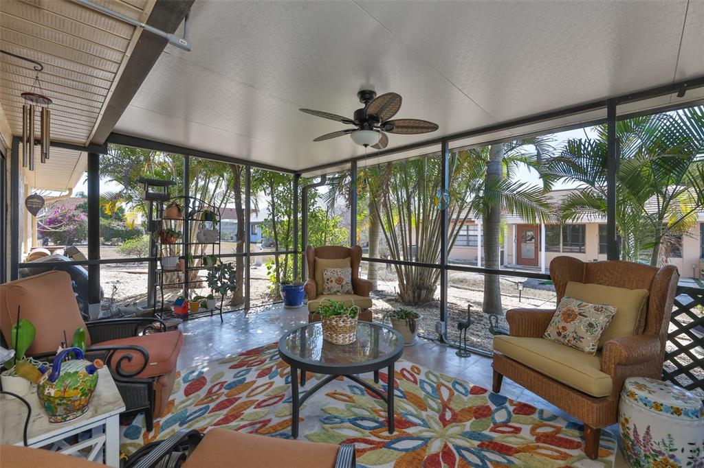 705 Baltusrol Way Sun City Center, FL 33573 - Photo 42 of 59 a living room with furniture and a large window