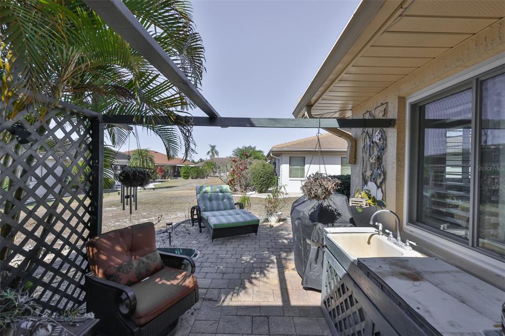 705 Baltusrol Way Sun City Center, FL 33573 - Photo 43 of 59 a outdoor living space with furniture