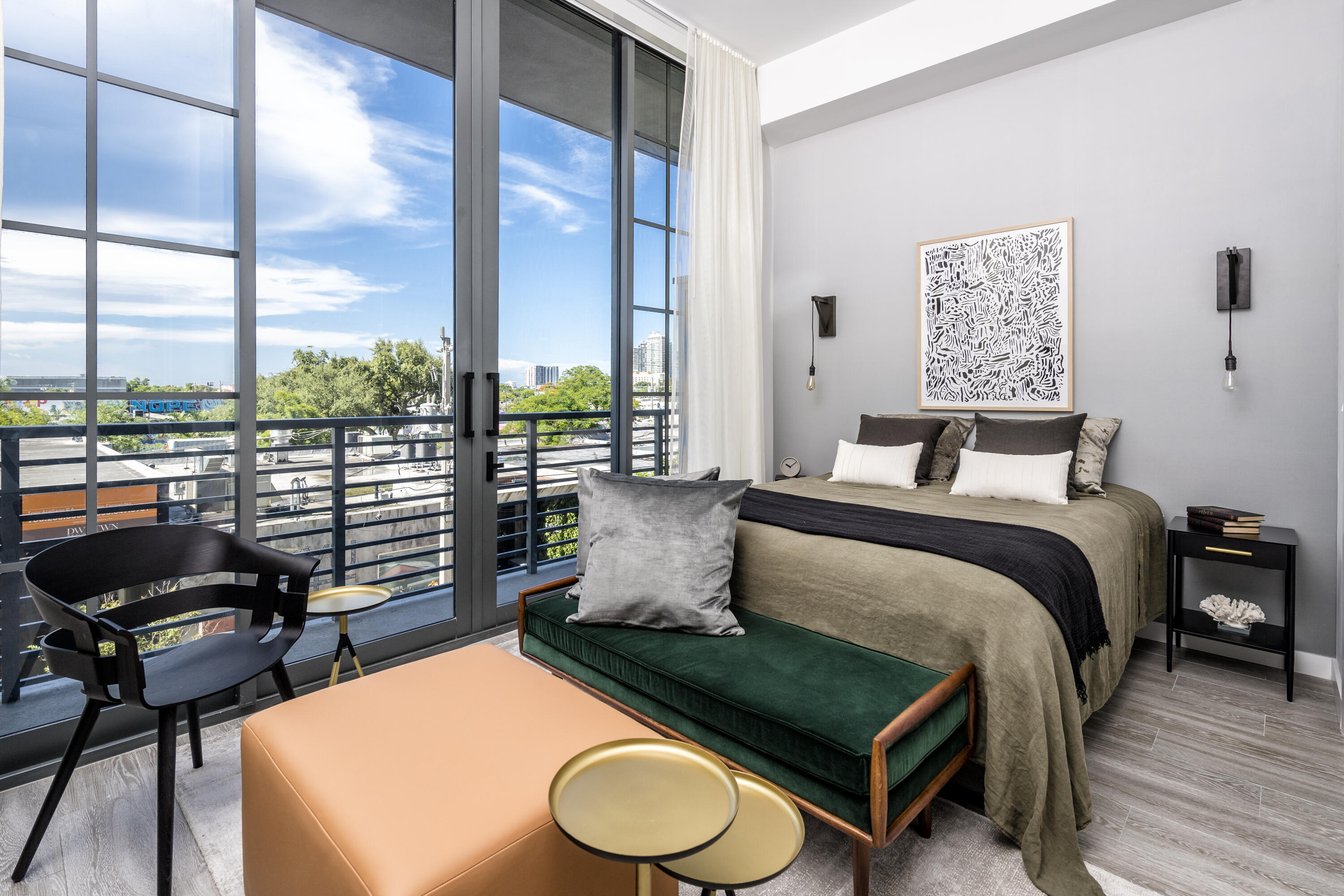 240 Northwest 25th Street, Unit 707 Miami, FL 33127 - Photo 2 of 16 a bedroom with a bed and wooden floor