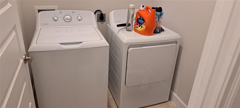 13052 Ogden Glade Road Dade City, FL 33525 - Photo 26 of 35 a utility room with dryer and washer