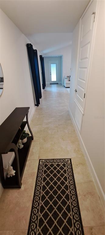 13052 Ogden Glade Road Dade City, FL 33525 - Photo 5 of 35 a bed sitting in a bedroom and dresser