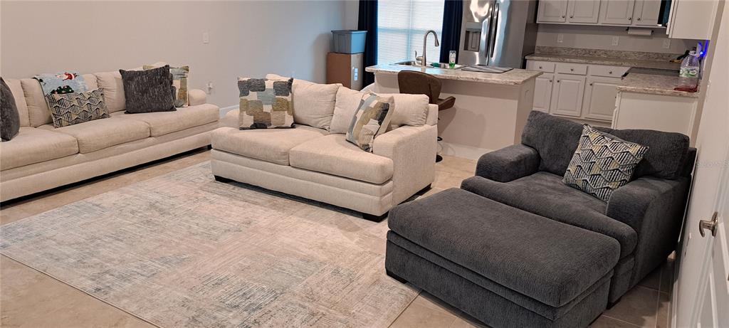 13052 Ogden Glade Road Dade City, FL 33525 - Photo 7 of 35 a living room with furniture and a couch