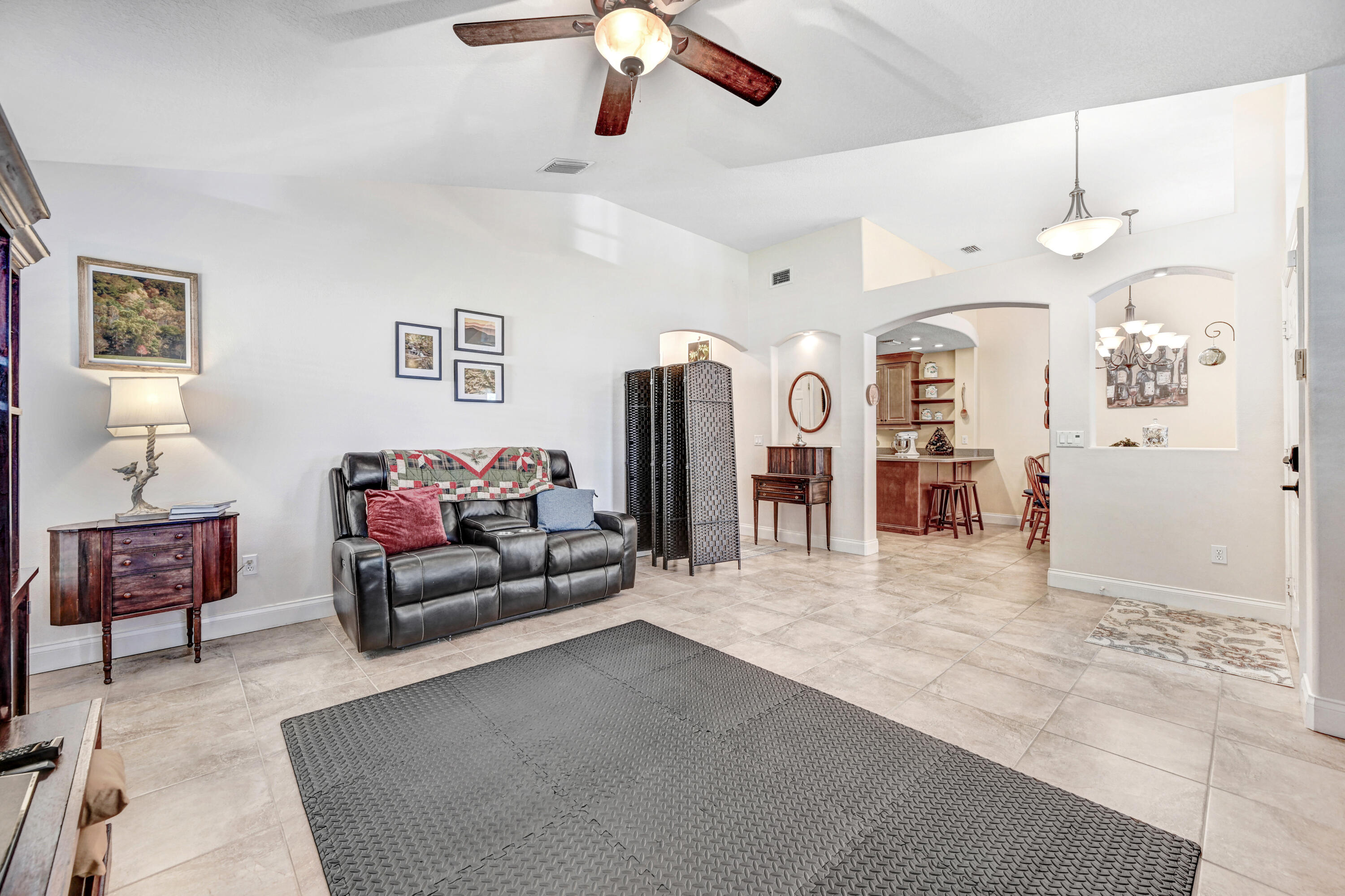 2795 Whistler Street Melbourne, FL 32904 - Photo 11 of 45 a living room with furniture and view of kitchen