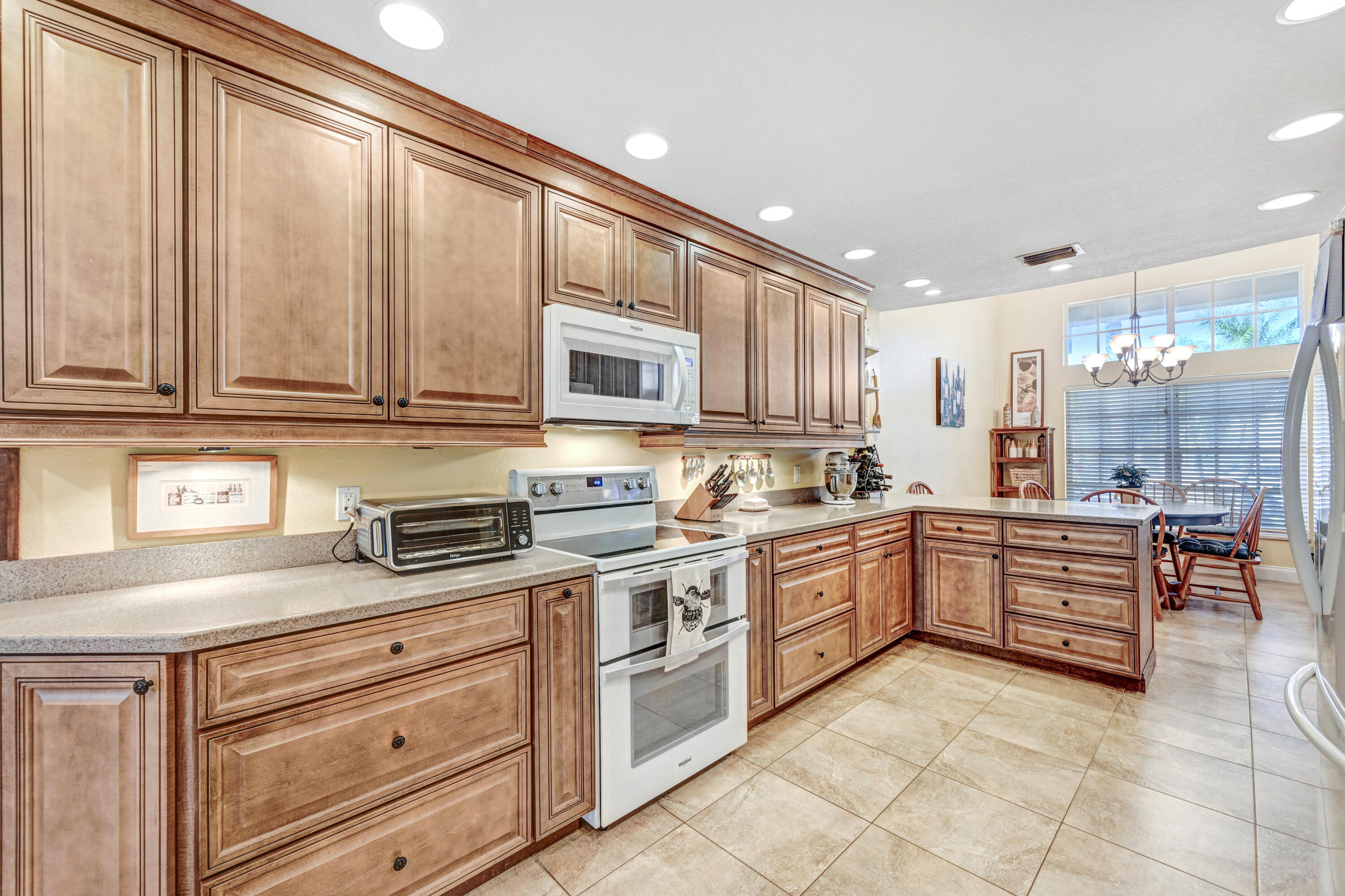 2795 Whistler Street Melbourne, FL 32904 - Photo 13 of 45 a kitchen with sink cabinets and window