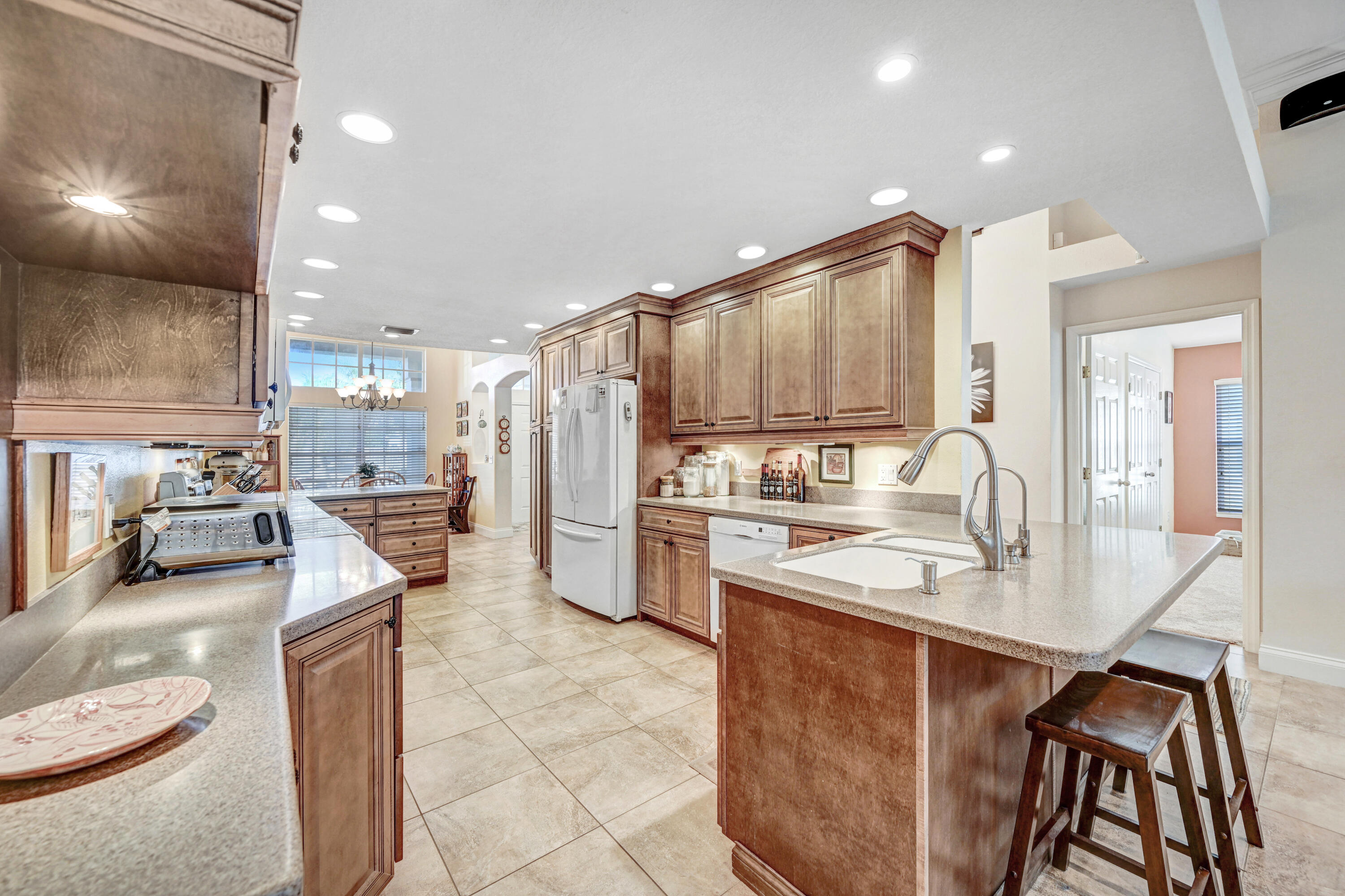 2795 Whistler Street Melbourne, FL 32904 - Photo 16 of 45 a kitchen with refrigerator and cabinets