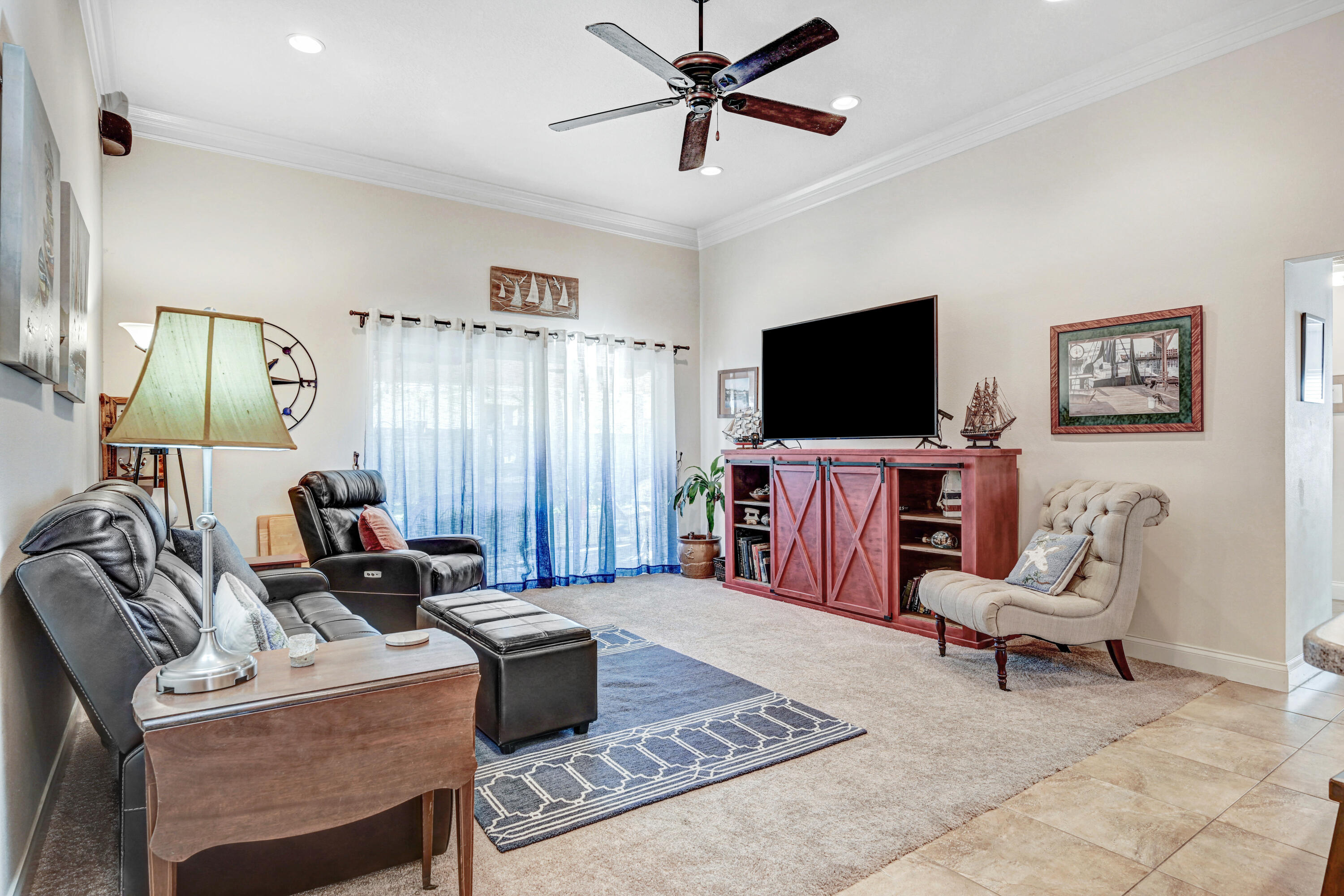 2795 Whistler Street Melbourne, FL 32904 - Photo 17 of 45 a living room with furniture and a flat screen tv