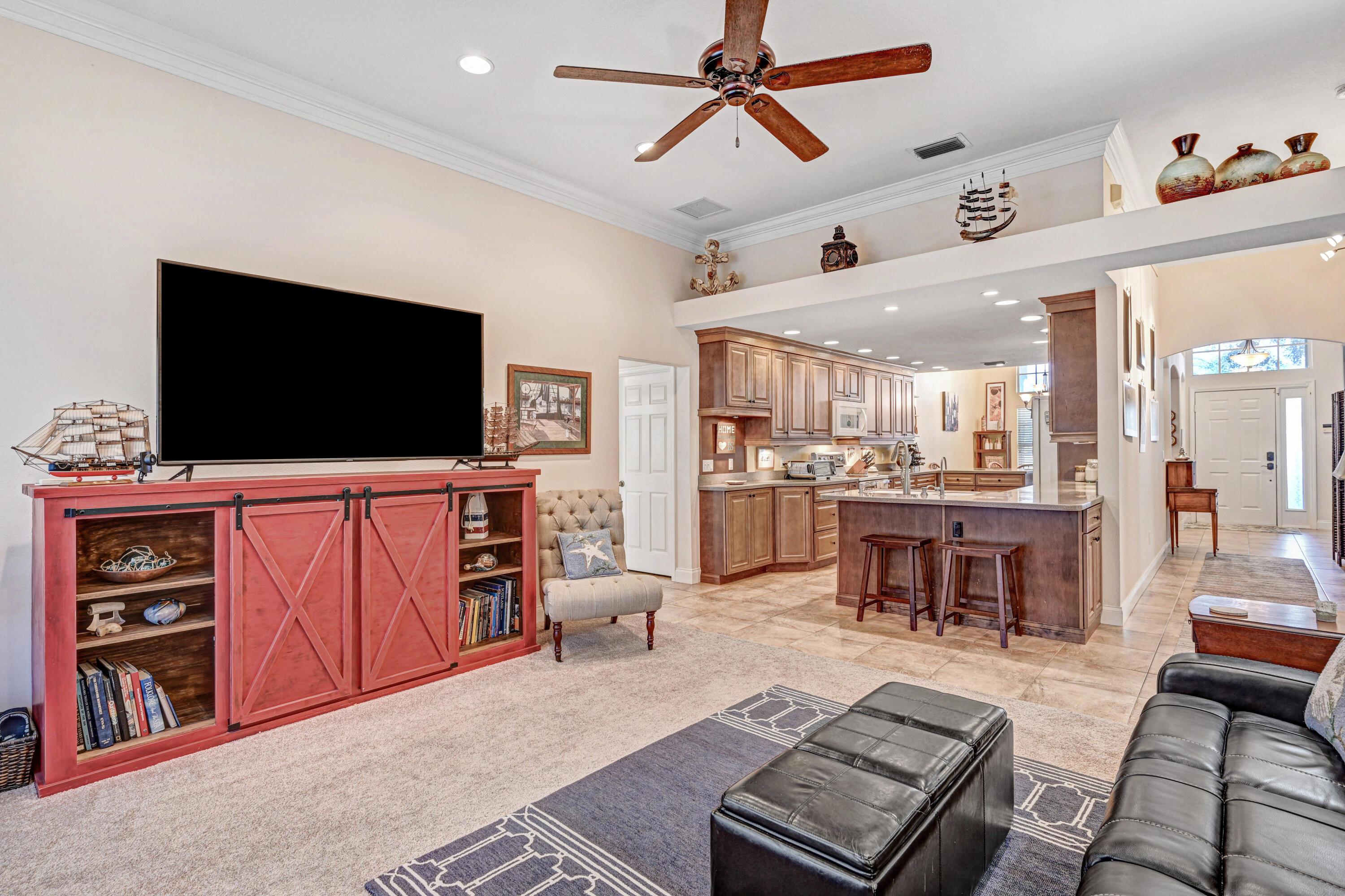 2795 Whistler Street Melbourne, FL 32904 - Photo 19 of 45 a living room with furniture and a flat screen tv