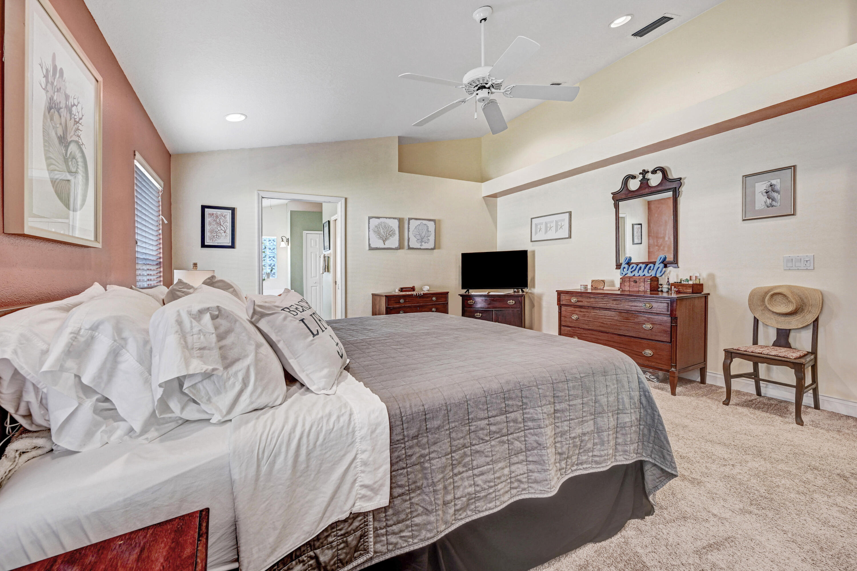 2795 Whistler Street Melbourne, FL 32904 - Photo 22 of 45 a bedroom with a bed and a dresser