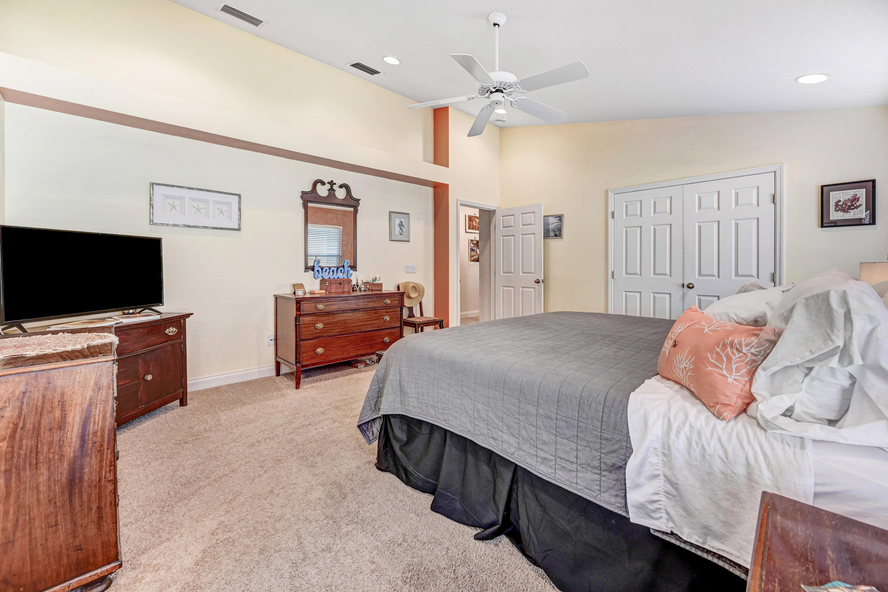 2795 Whistler Street Melbourne, FL 32904 - Photo 23 of 45 a spacious bedroom with a bed and a flat screen tv