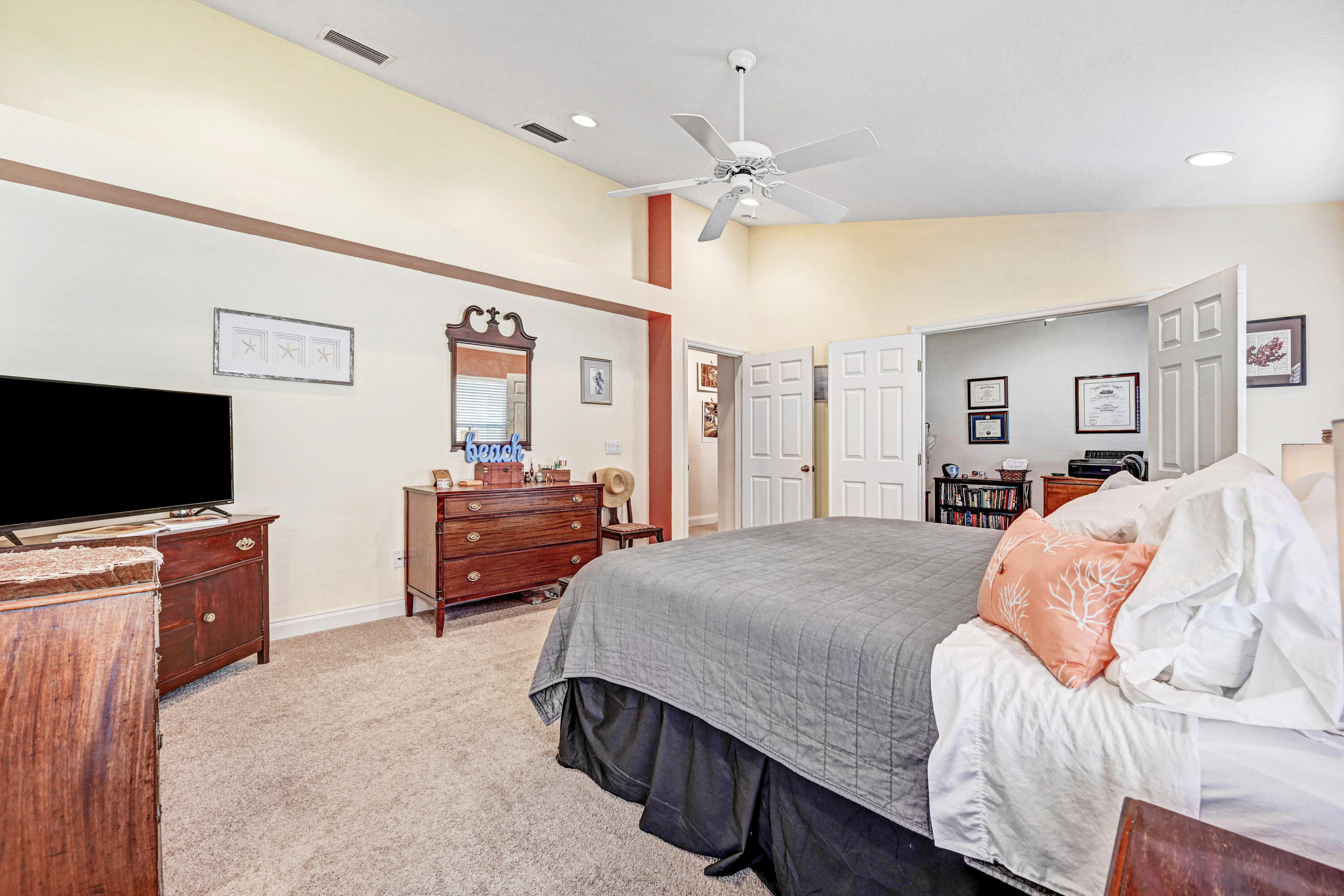 2795 Whistler Street Melbourne, FL 32904 - Photo 28 of 45 a bedroom with a bed and a flat screen tv