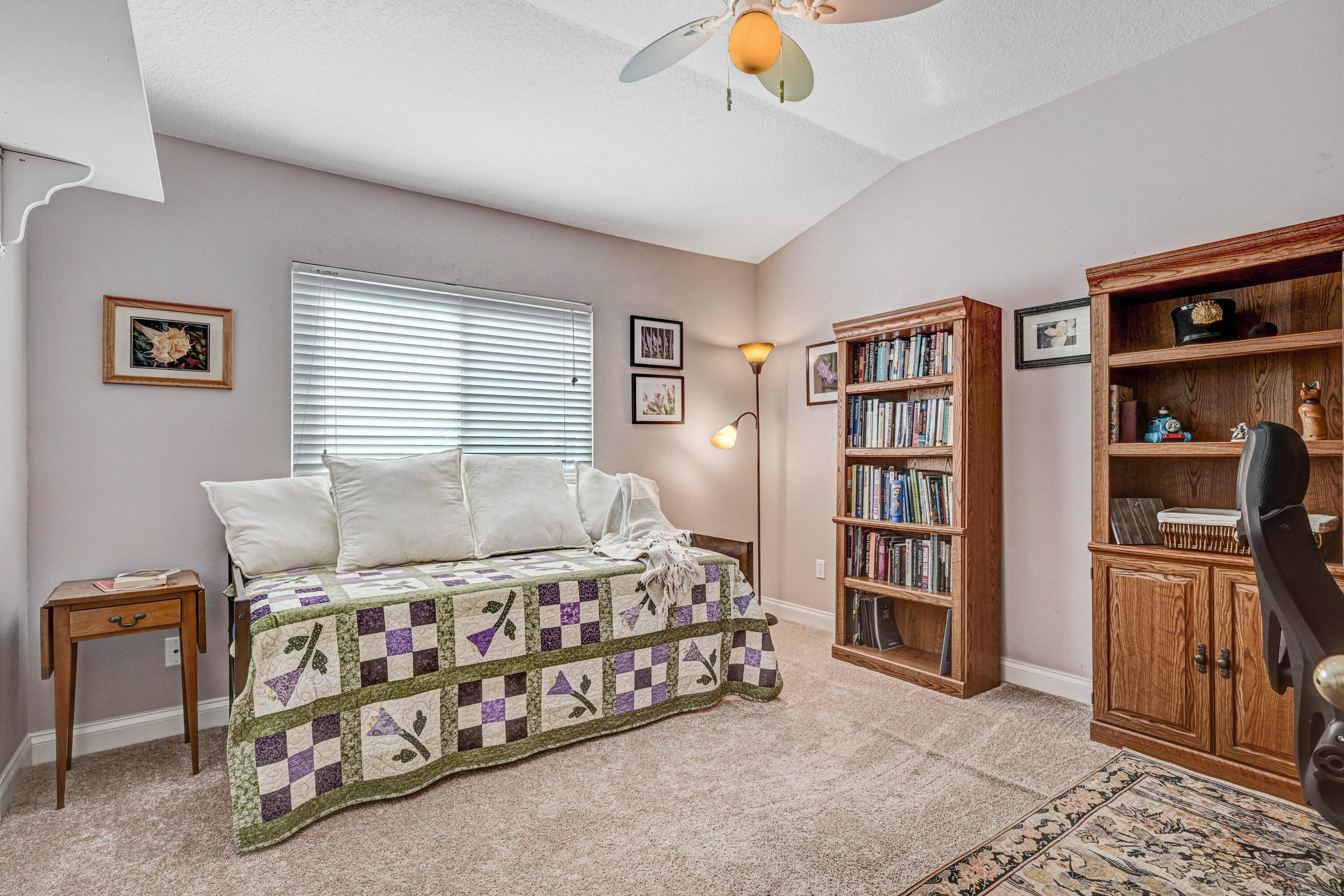 2795 Whistler Street Melbourne, FL 32904 - Photo 29 of 45 a bedroom with furniture and a book shelf