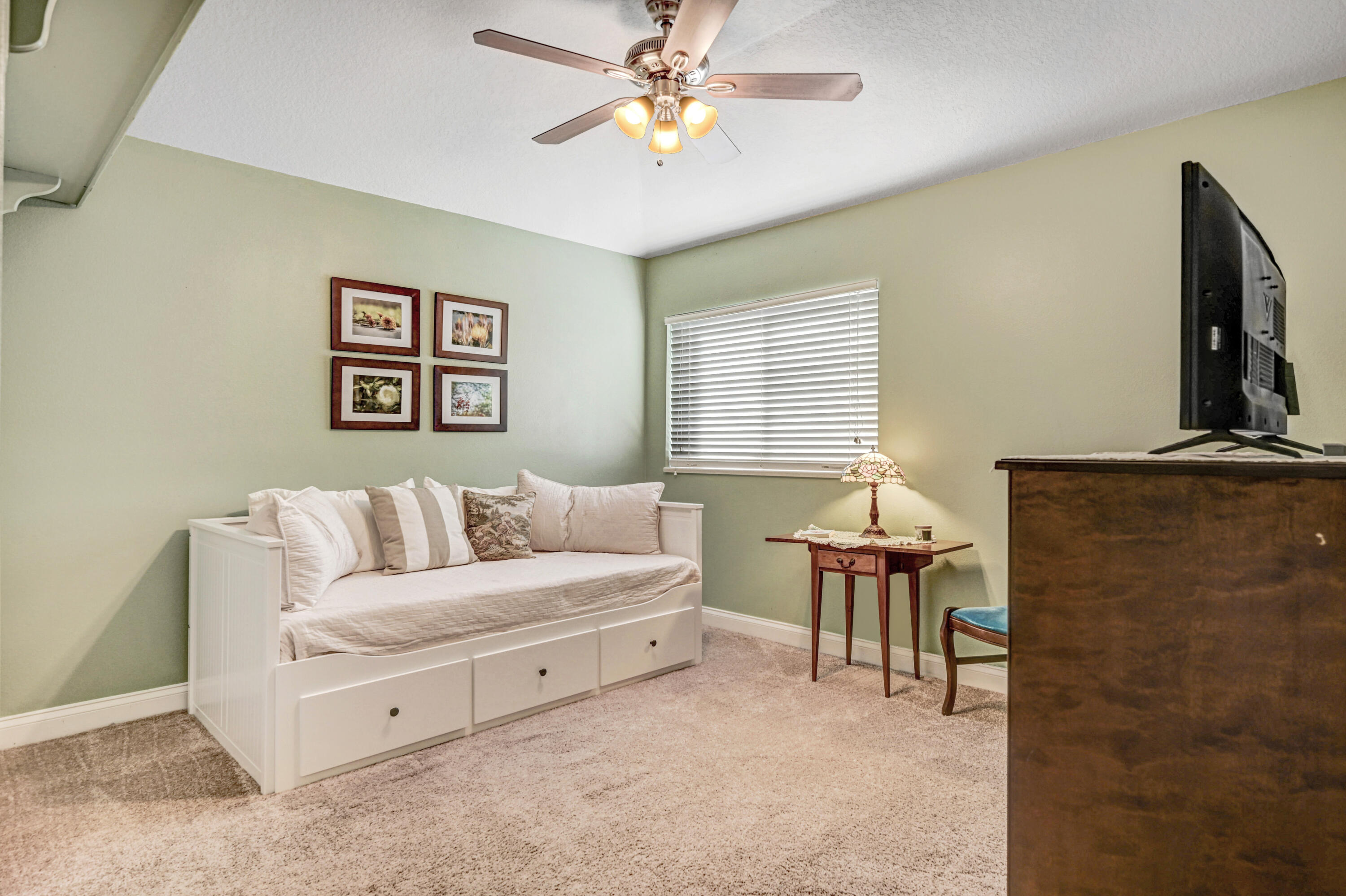 2795 Whistler Street Melbourne, FL 32904 - Photo 31 of 45 a living room with furniture and a flat screen tv