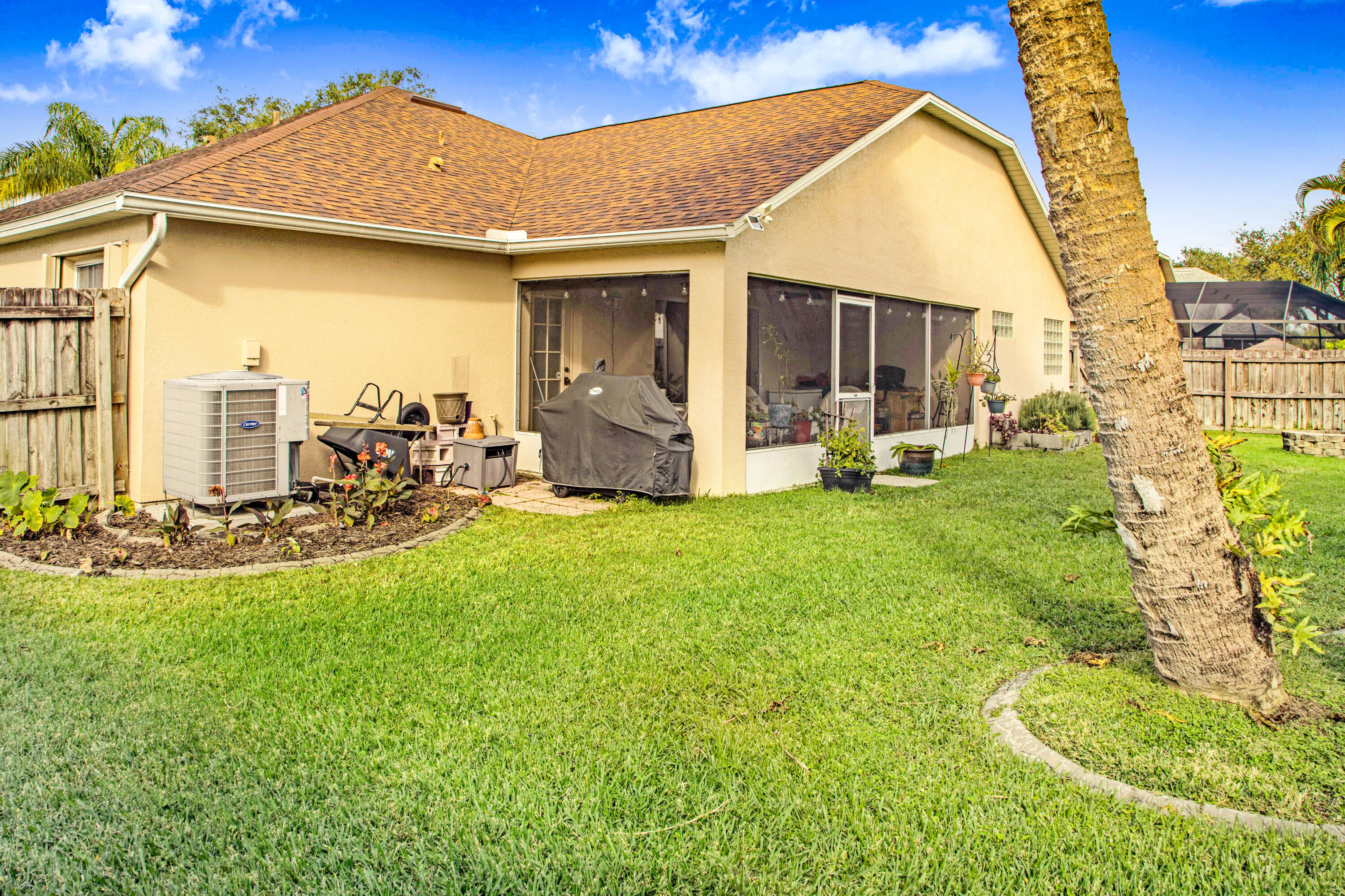 2795 Whistler Street Melbourne, FL 32904 - Photo 33 of 45 a view of a house with backyard porch and sitting area
