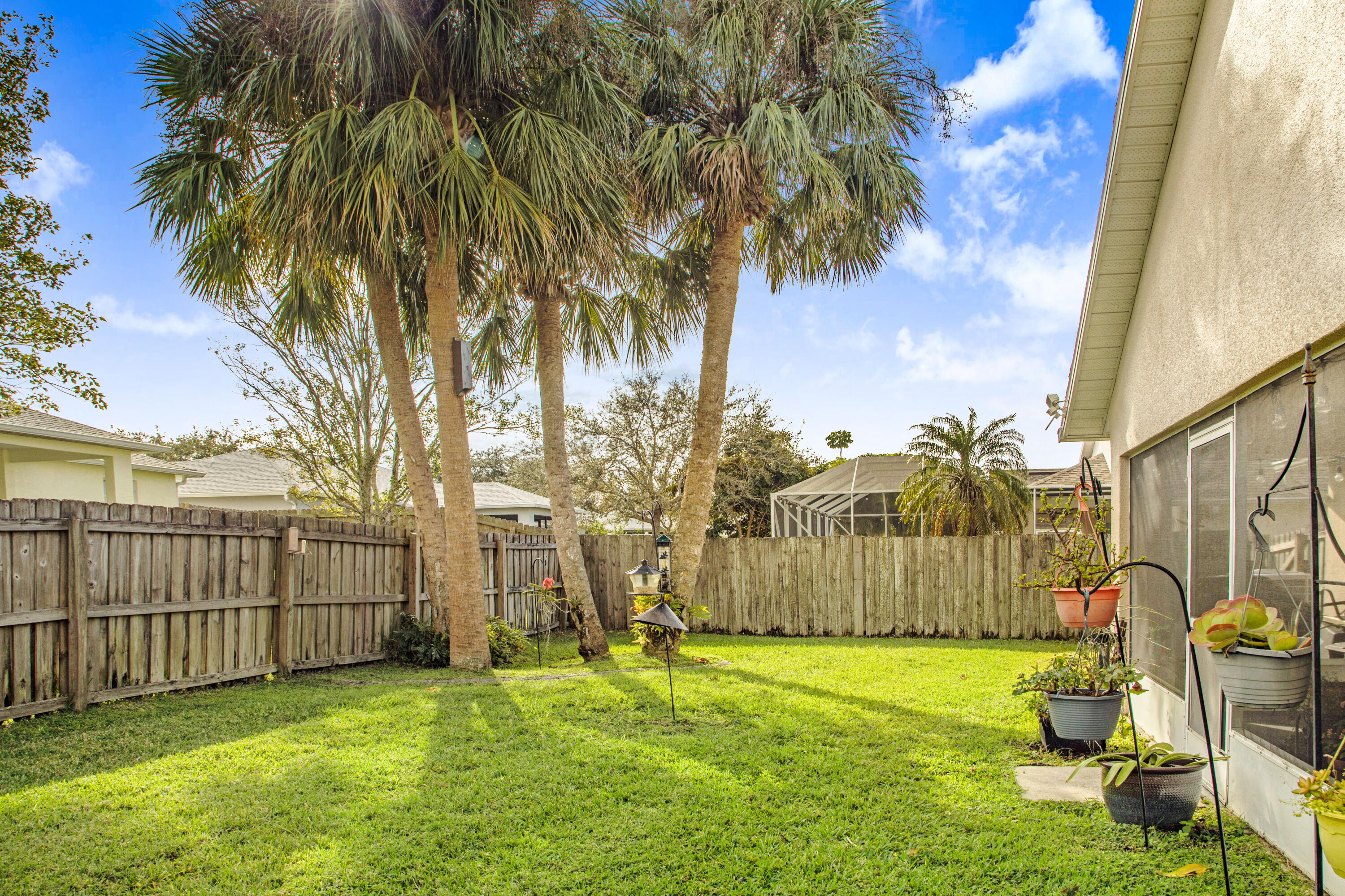 2795 Whistler Street Melbourne, FL 32904 - Photo 34 of 45 a backyard of a house with table and chairs