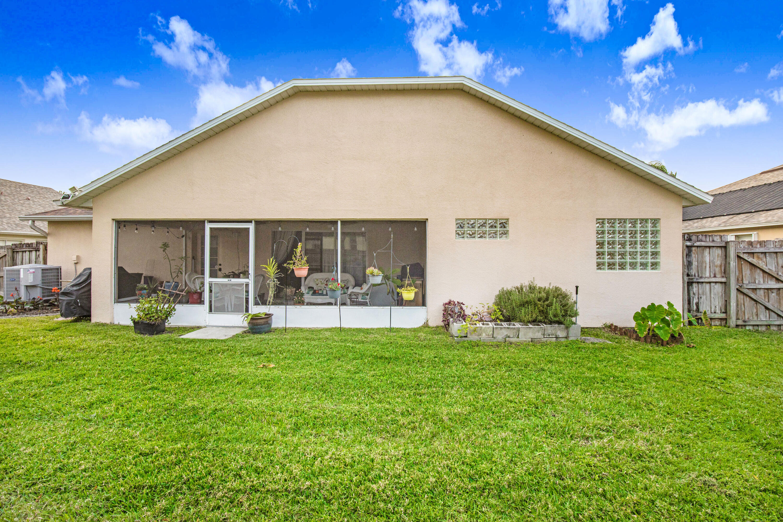 2795 Whistler Street Melbourne, FL 32904 - Photo 5 of 45 a view of a house with backyard porch and sitting area