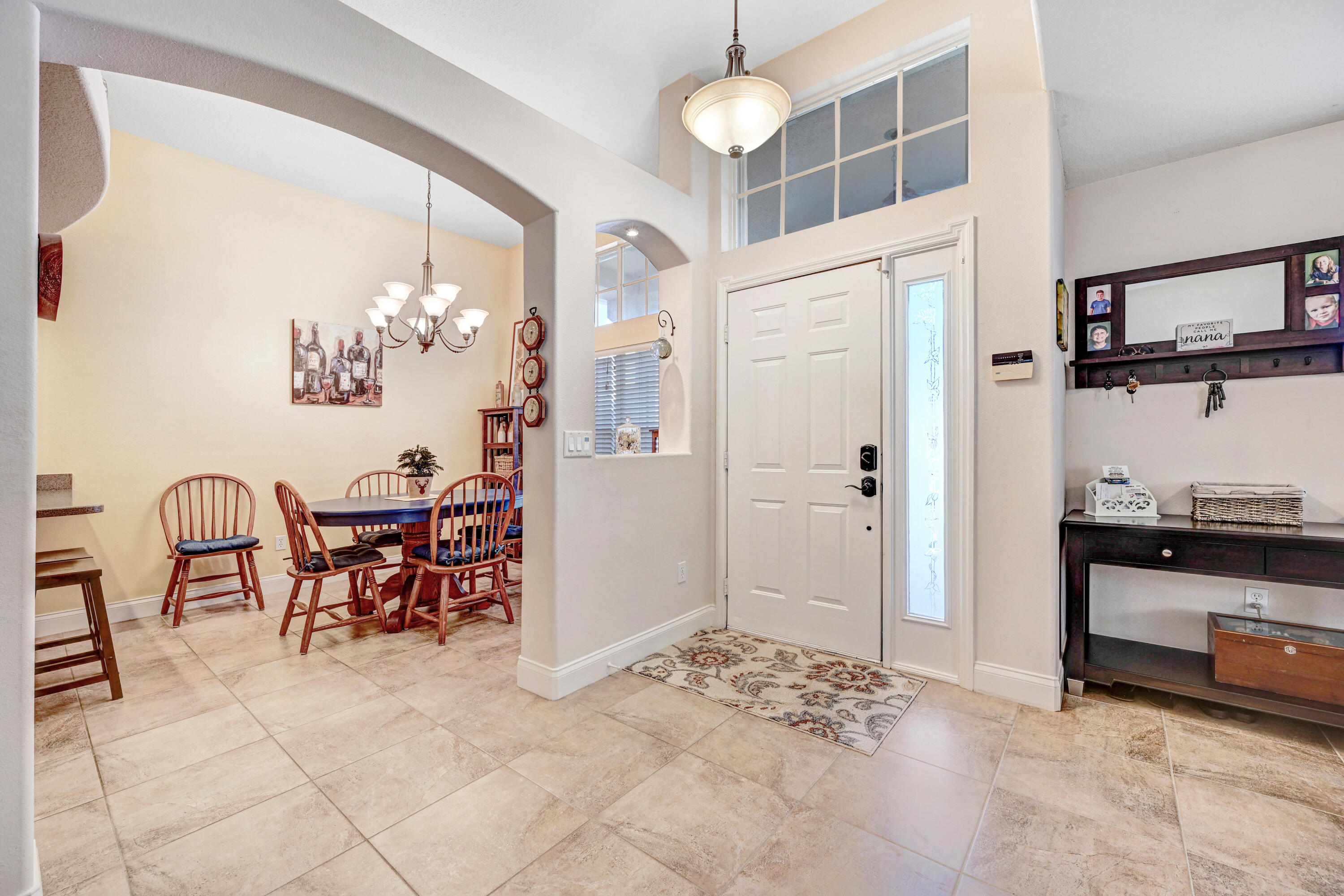 2795 Whistler Street Melbourne, FL 32904 - Photo 7 of 45 a view of kitchen and dining area with chandelier