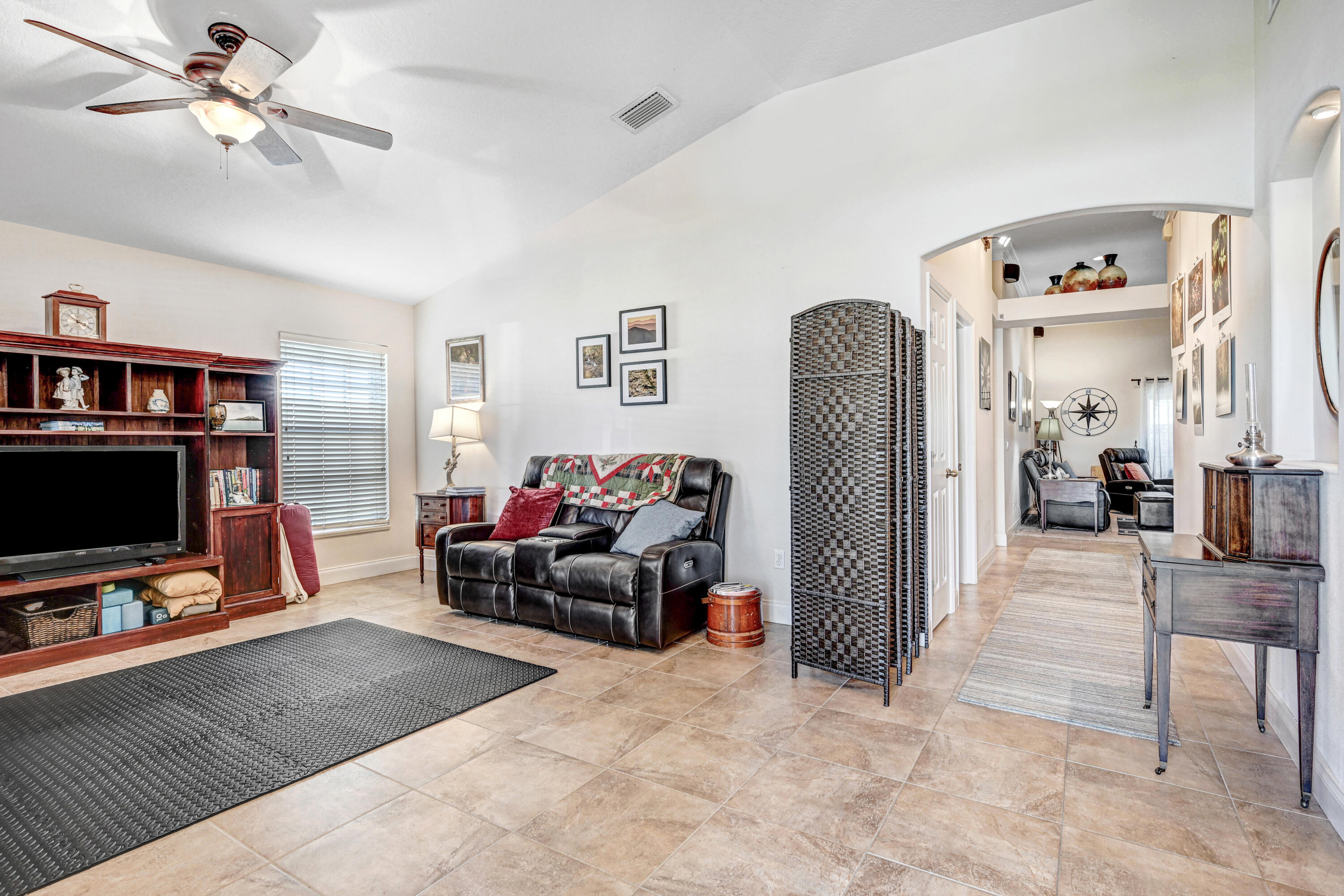 2795 Whistler Street Melbourne, FL 32904 - Photo 8 of 45 a living room with furniture and a flat screen tv
