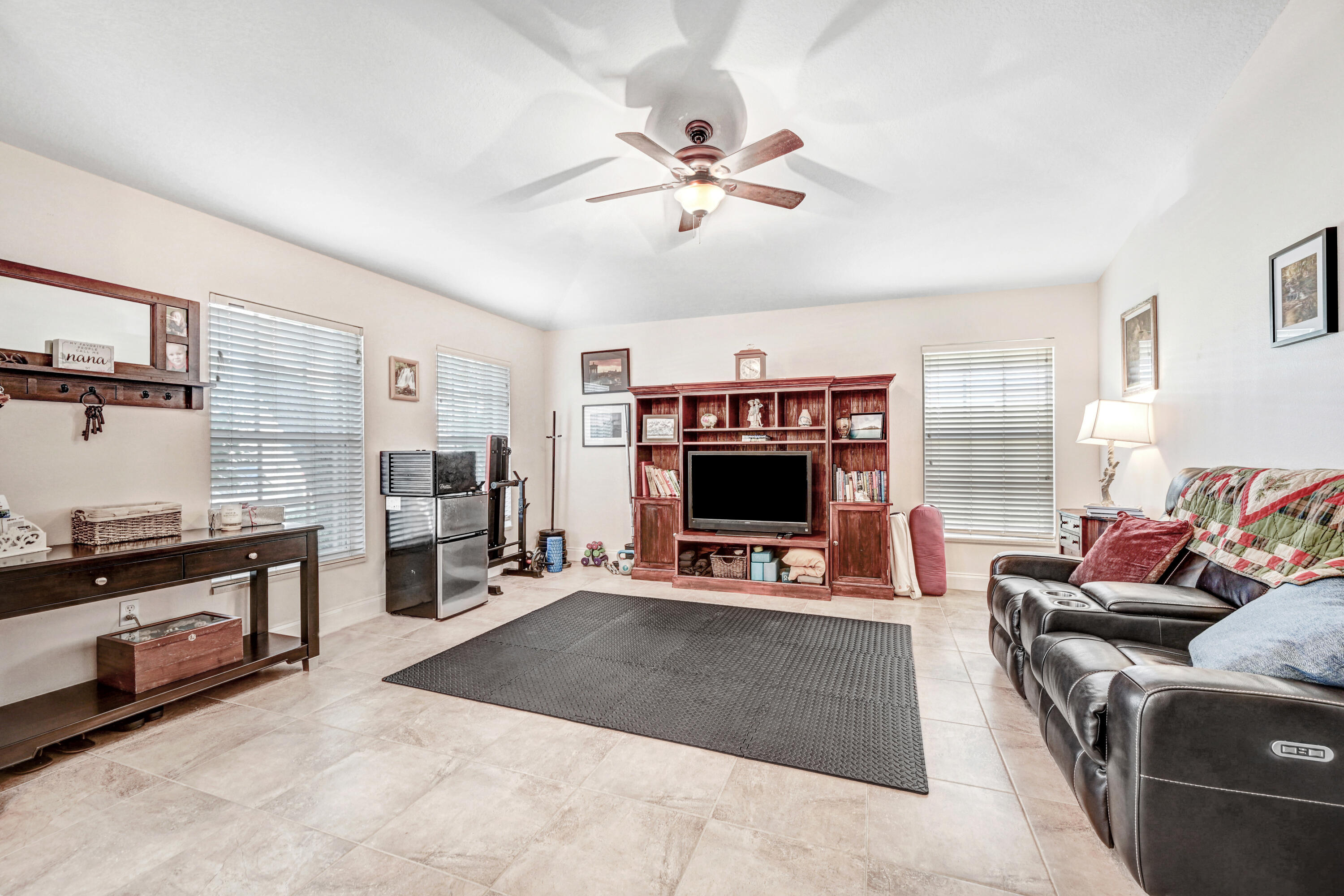 2795 Whistler Street Melbourne, FL 32904 - Photo 10 of 45 a living room with furniture and a flat screen tv