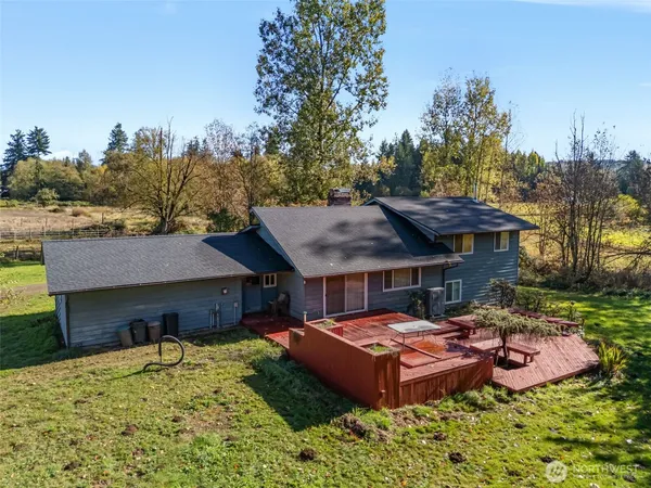 a view of a house with a yard and roof