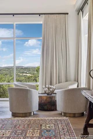 a bed room with couch and a window