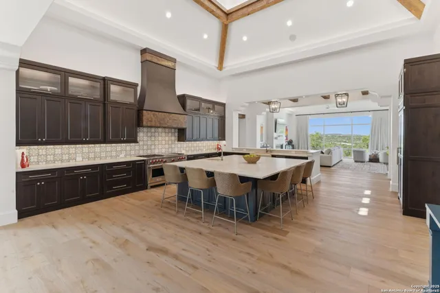 a bedroom with a bed couch tv and a window