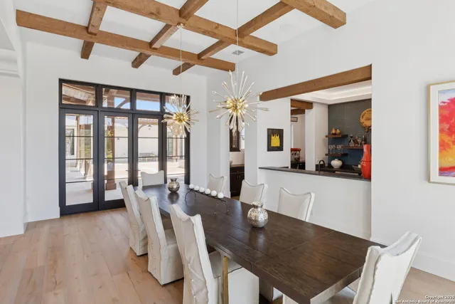 a view of a livingroom with furniture and floor to ceiling window