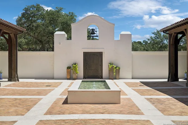 a view of a dining room with furniture a chandelier and wooden floor