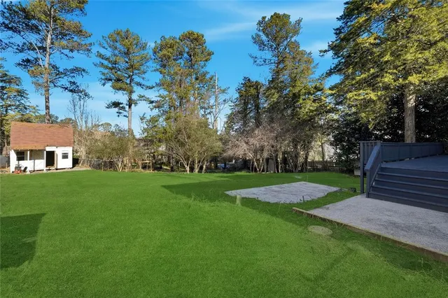 a view of a park with large trees
