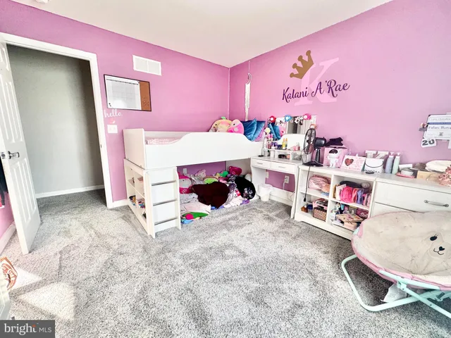 a bed room with a bed and a couch