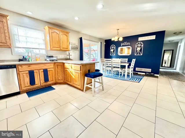 a living room with granite countertop kitchen view and furniture