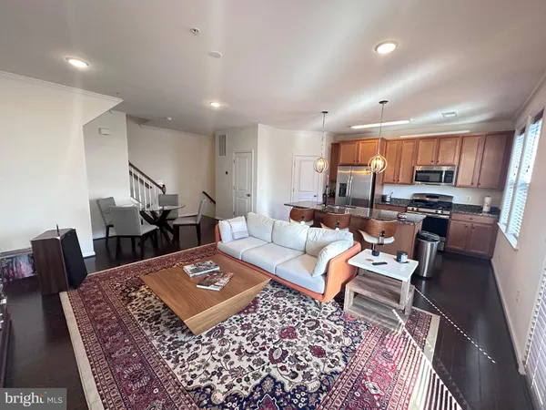 a living room with furniture and a rug