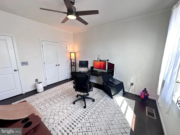 a bedroom with bed and window