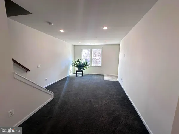 an empty room with wooden floor