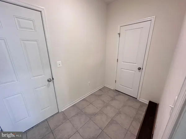 a view of a room with racks on the wall