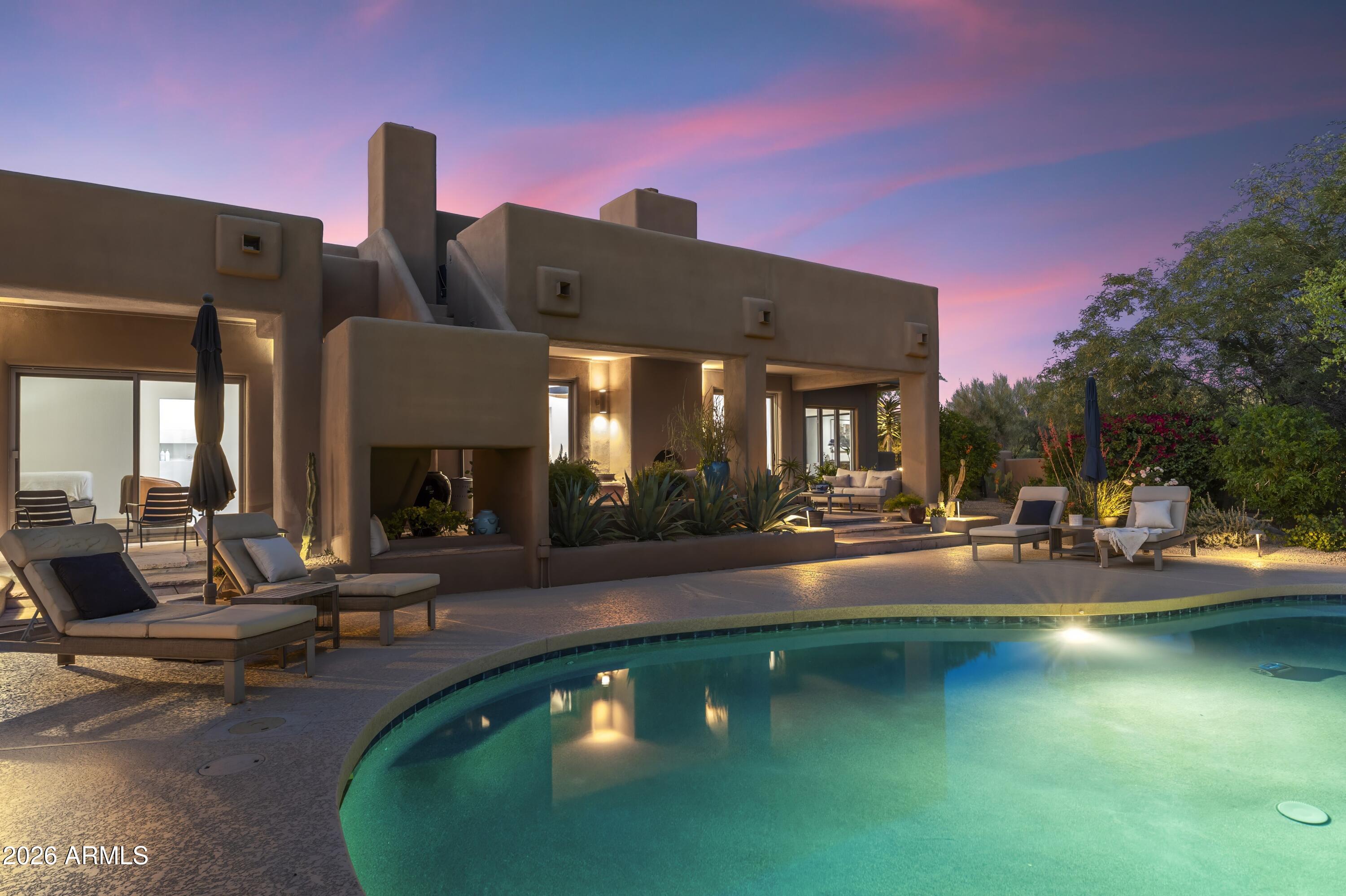 10046 East Hidden Valley Road Scottsdale, AZ 85262 - Photo 53 of 64 a view of a swimming pool with outdoor seating