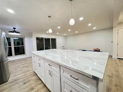 a view of living room with wooden floor