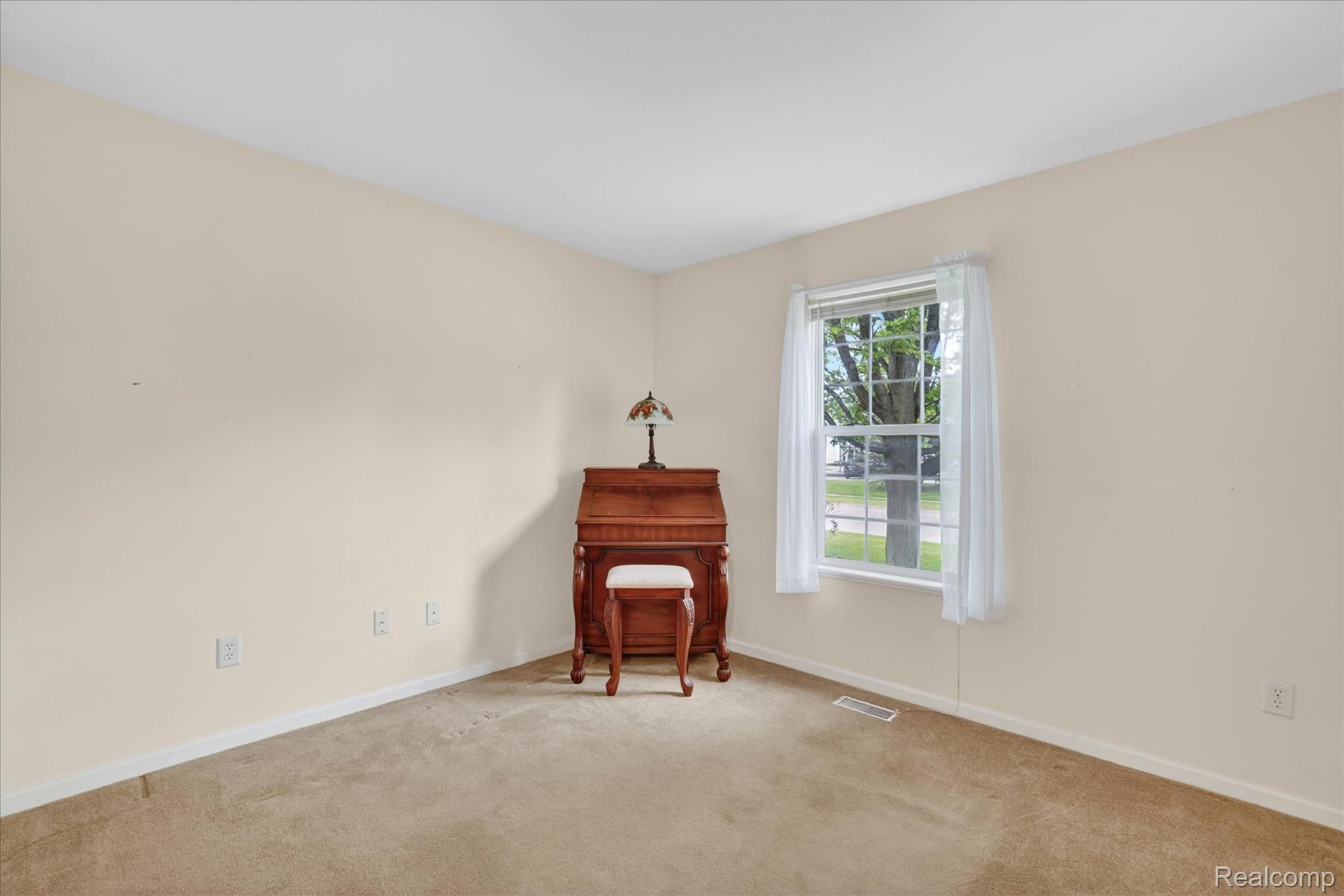 1607 Cedarwood Drive Flushing, MI 48433 - Photo 16 of 27 Sitting room with carpet flooring and baseboards