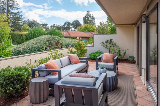 a outdoor living space with furniture and garden view