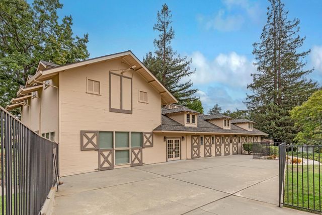 a view of a house with a yard and deck