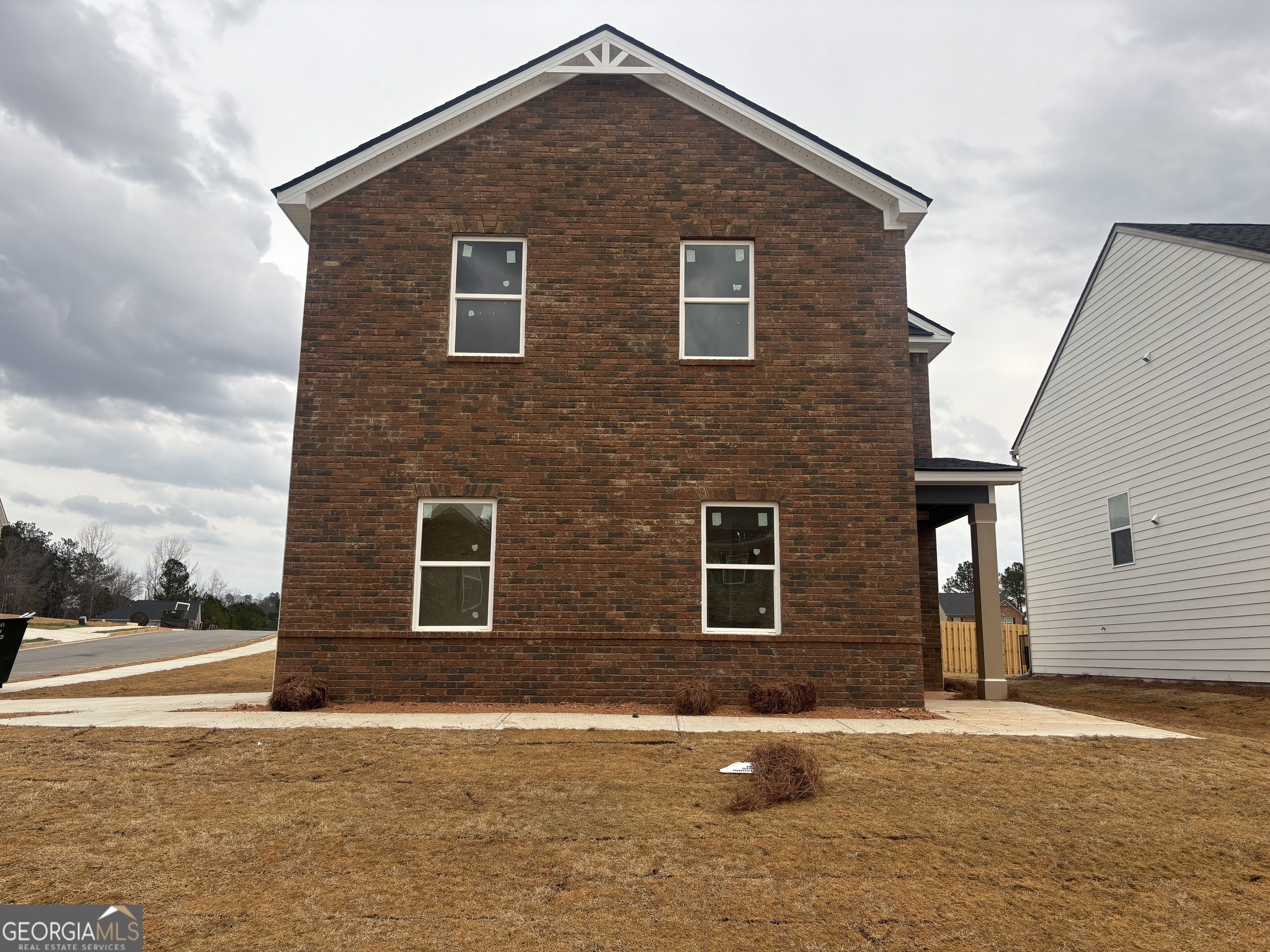 5301 Tolar Road, Unit 95 Fairburn, GA 30213 - Photo 1 of 1 a front view of a house with a yard and garage