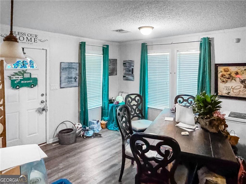 230 Surrett Road Buchanan, GA 30113 - Photo 6 of 17 a view of a dining room with furniture and chandelier
