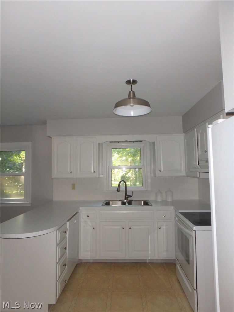 2546 Durand Road Fairlawn, OH 44333 - Photo 4 of 17 Next we find the eat in kitchen with loads of storage including a large pantry and windows into the back yard