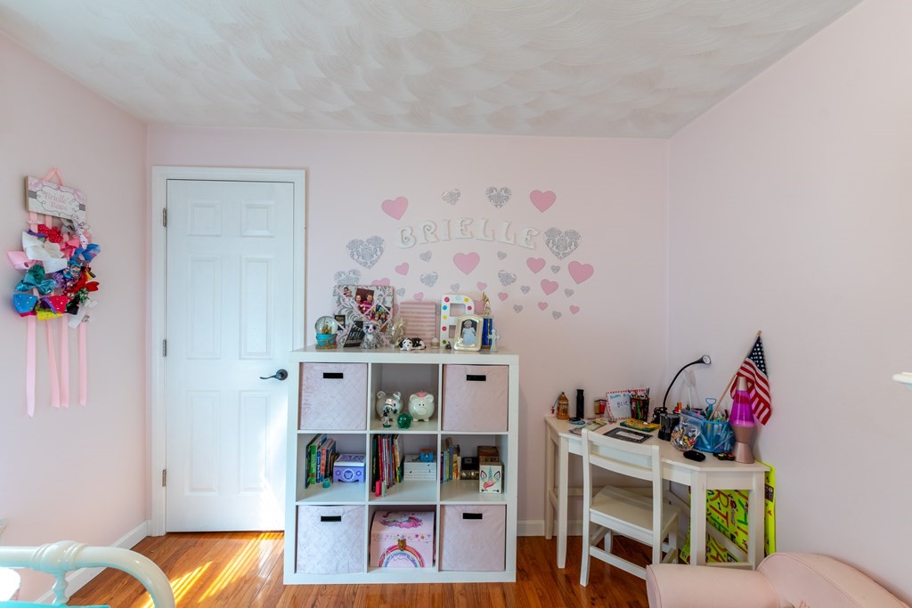 97 Bay State Road Methuen, MA 01844 - Photo 15 of 26 a room with furniture and book shelf