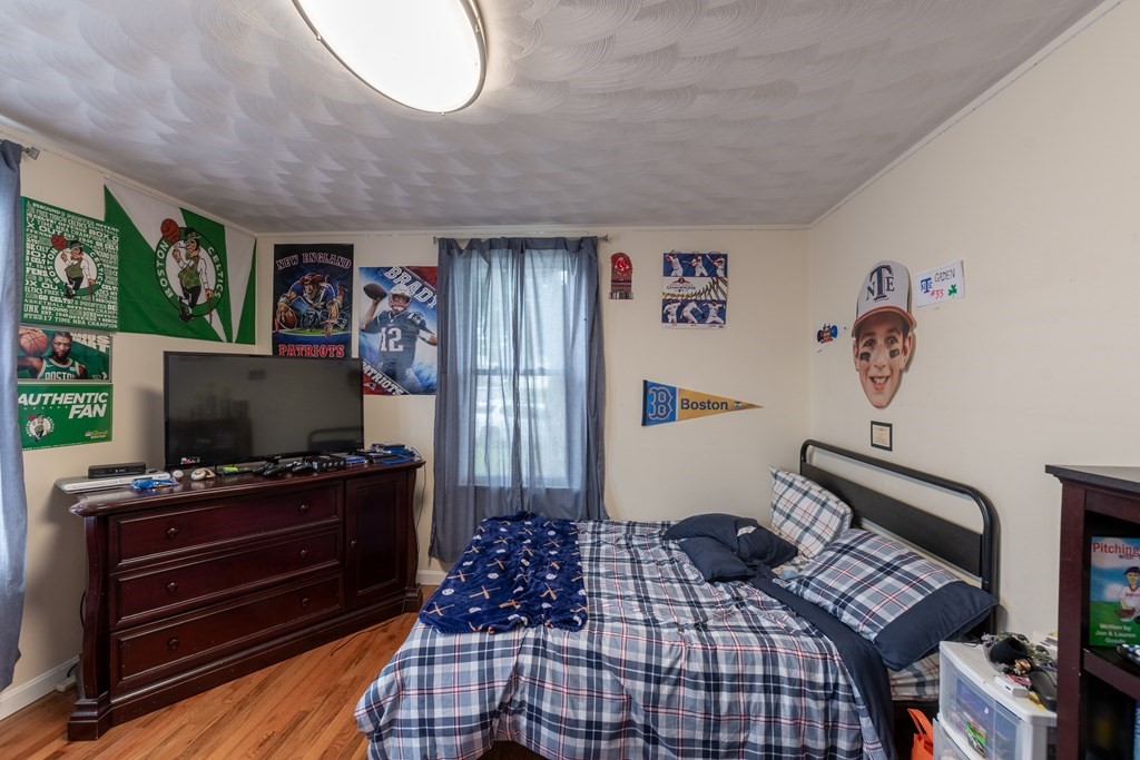 97 Bay State Road Methuen, MA 01844 - Photo 16 of 26 a bedroom with furniture and flat screen tv