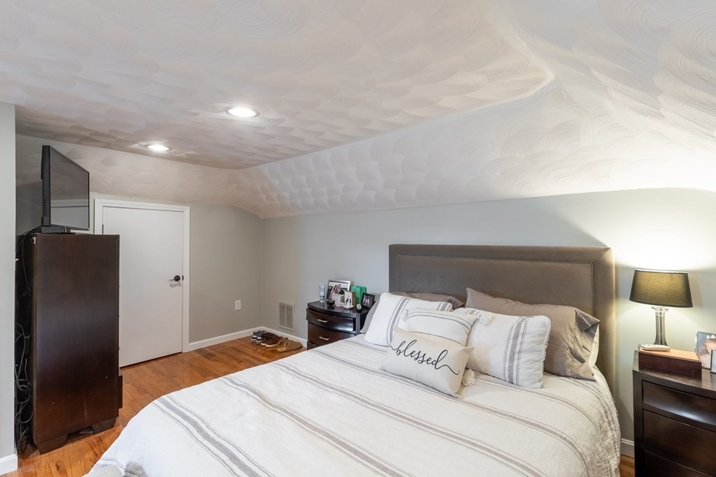 97 Bay State Road Methuen, MA 01844 - Photo 19 of 26 a bedroom with a bed and a lamp