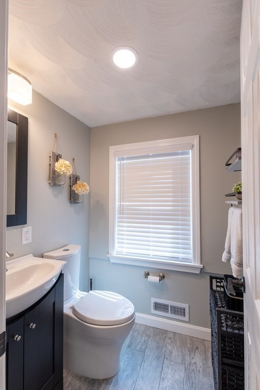 97 Bay State Road Methuen, MA 01844 - Photo 20 of 26 a bathroom with a toilet a sink and a window