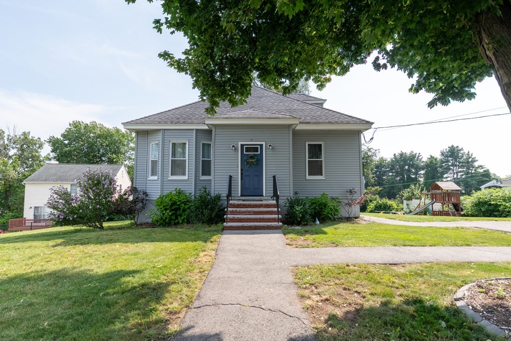 97 Bay State Road Methuen, MA 01844 - Photo 2 of 26 a front view of a house with garden